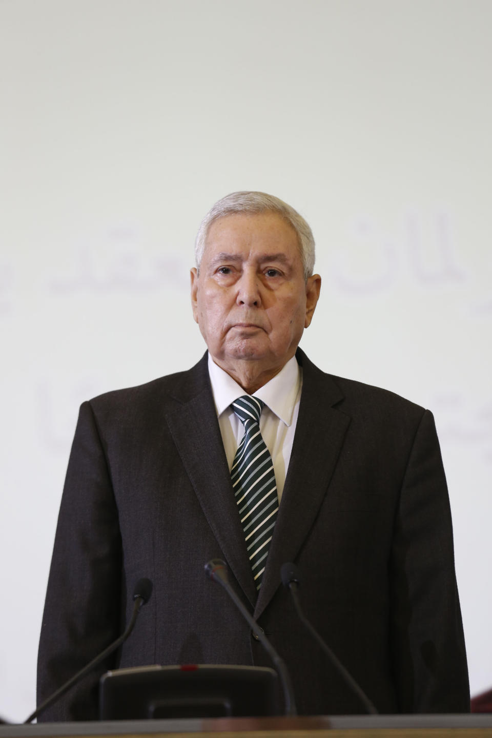 Abdelkader Bensalah listens while being named interim leader to replace former Algerian President Abdelaziz Bouteflika, in Algiers, Tuesday, April 9, 2019. As called for by the Algerian Constitution, Bensalah was named as interim leader for a maximum of 90 days until a new election can be organized. He can't run for the post himself. (AP Photo/Toufik Doudou)