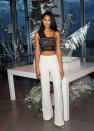 <p>Showing off her toned body in a beaded crop top and white pants. <i>(Photo by Desiree Navarro/WireImage)</i></p>