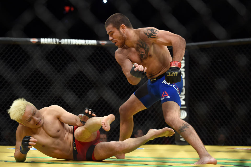 Las Vegas, CA - July 09:Jim Miller (red) battles Takanori Gomi (blue) during UFC 200, Saturday, July 9, 2016, at theT-Mobile Arena, in Las Vegas, NV. Miller won by first round TKO. (Photo by Hans Gutknecht/MediaNews Group/Los Angeles Daily News via Getty Images)