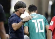 FILE - In this June 27, 2018 file photo Germany head coach Joachim Loew, left, talks to Germany's Mesut Ozil, right, during the group F match between South Korea and Germany, at the 2018 soccer World Cup in the Kazan Arena in Kazan, Russia. UEFA will decide Thursday, Sept 27, 2018 on the host country for the 2024 soccer Euro. (AP Photo/Lee Jin-man)