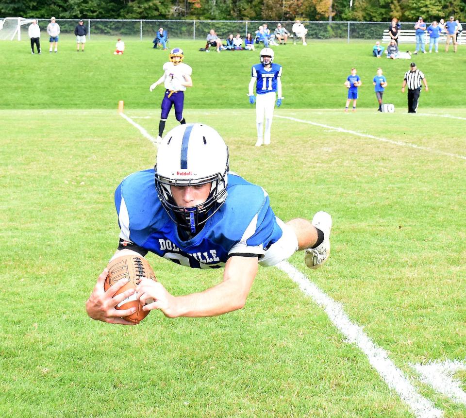 Kamryn Comstock, pictured makes a diving catch for a touchdown against Waterville/Hamilton Oct. 2, 2021, is one of the returning players from Dolgeville's 2021 sectional championship team.