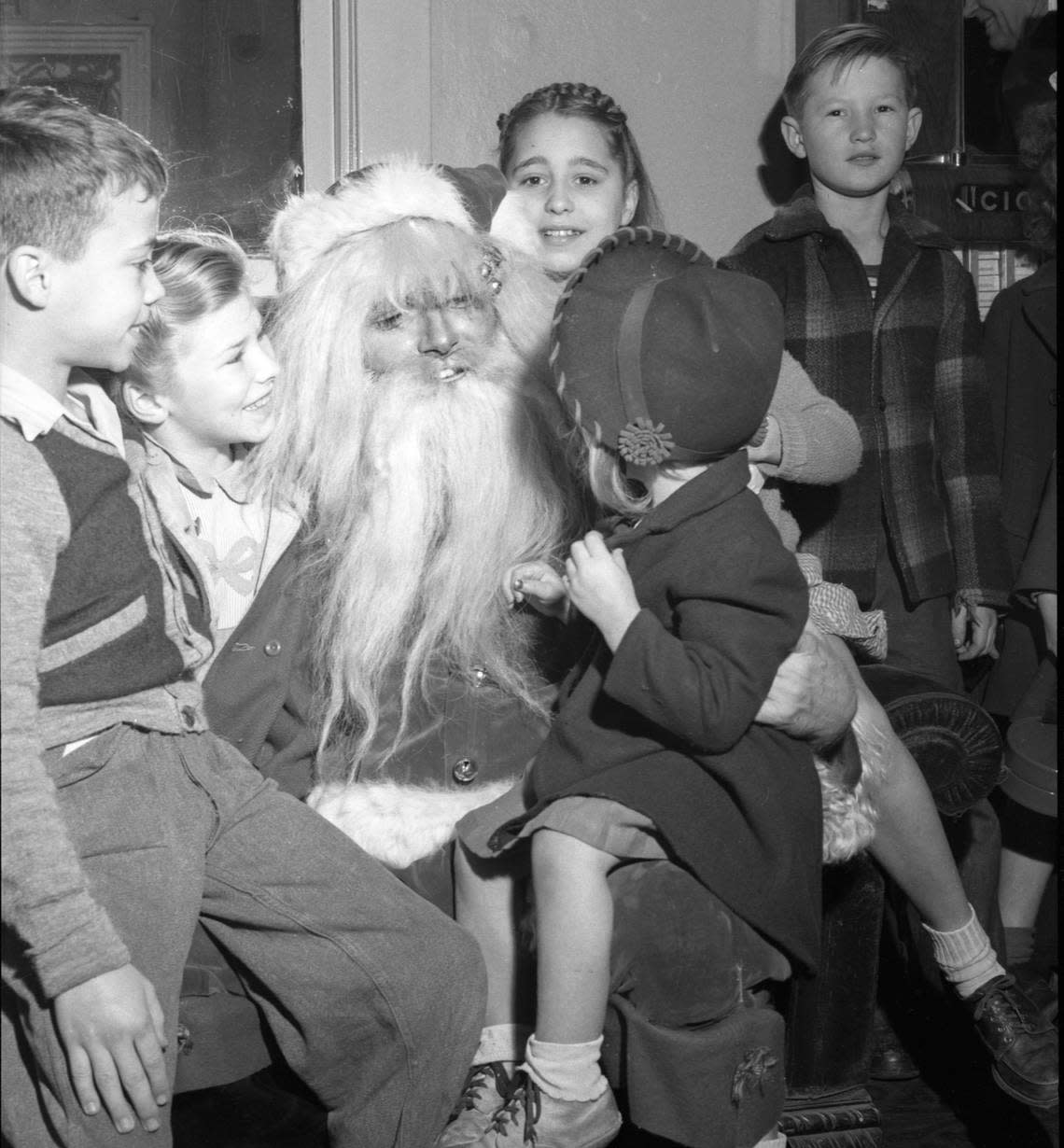 Santa Claus visits with some of the more than 5,000 youngsters at the first performance of the annual Christmas show sponsored by The Sacramento Bee, KFBK and the retail merchants association in 1946. Bee file/Center for Sacramento History