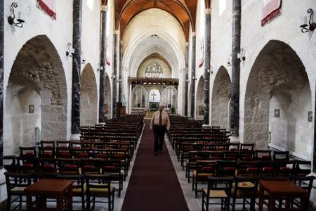 A church official walks inside the Anglican St. George's Cathedral in Jerusalem, June 13, 2018. Picture taken June 13, 2018. REUTERS/Ammar Awad