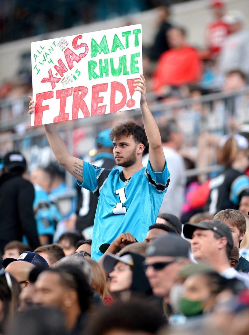 A Carolina Panthers fan reveals his Christmas wish on Dec. 26, 2021, as the Panthers fell 32-6 to Tampa Bay in the midst of a season-ending, seven-game losing streak.