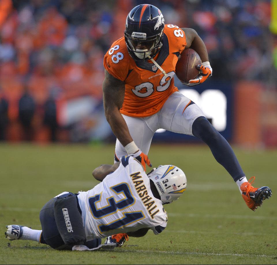 Denver Broncos wide receiver Demaryius Thomas (88) steps over San Diego Chargers cornerback Richard Marshall in the third quarter of an NFL AFC division playoff football game, Sunday, Jan. 12, 2014, in Denver. (AP Photo/Jack Dempsey)