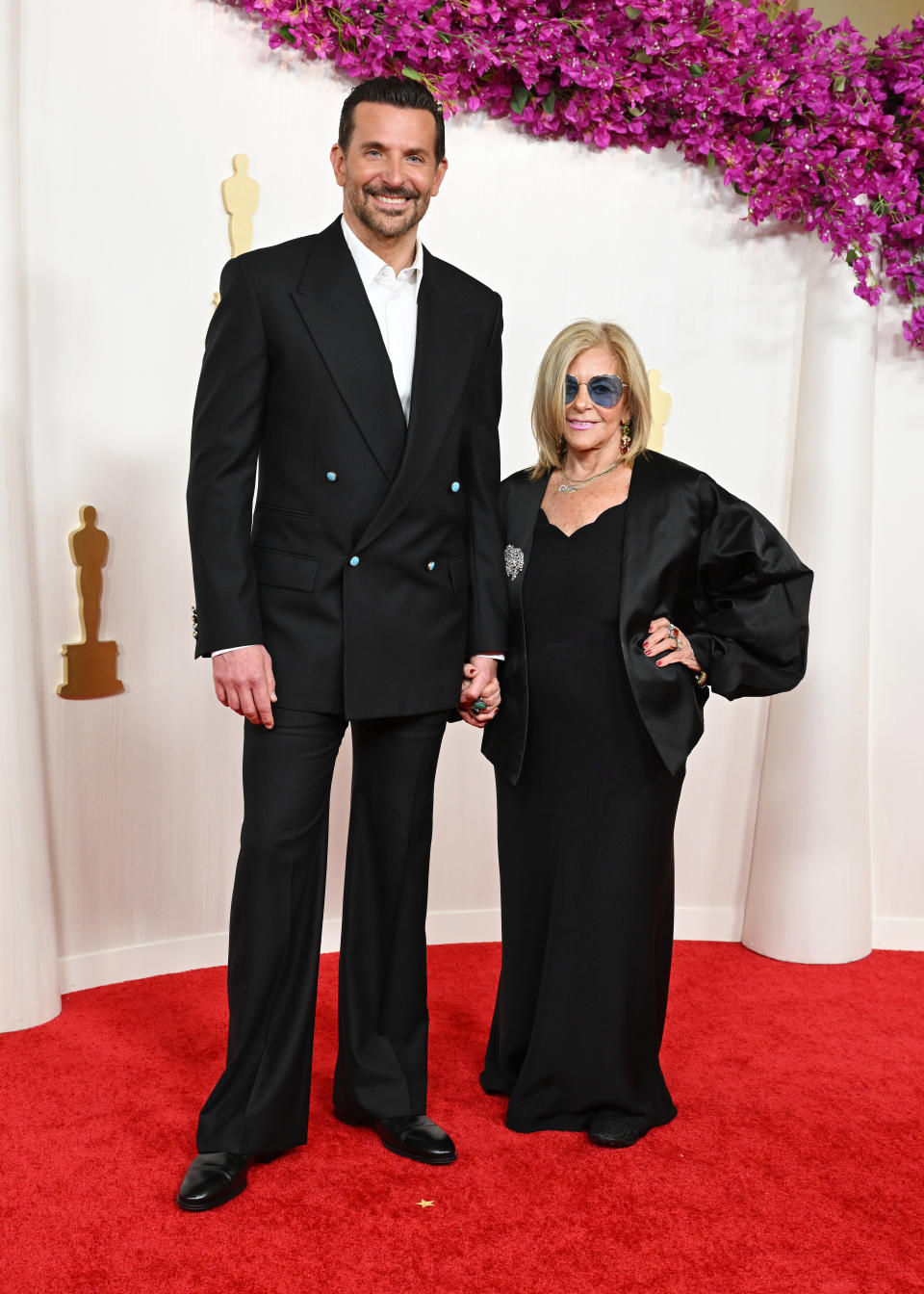 Bradley Cooper and Gloria Campano at the 96th Annual Oscars held at at the Ovation Hollywood on March 10, 2024 in Los Angeles, California. (Photo by Gilbert Flores/Variety via Getty Images)