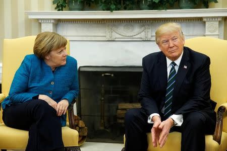 U.S. President Donald Trump meets with Germany's Chancellor Angela Merkel in the Oval Office at the White House in Washington, U.S. March 17, 2017. REUTERS/Jonathan Ernst