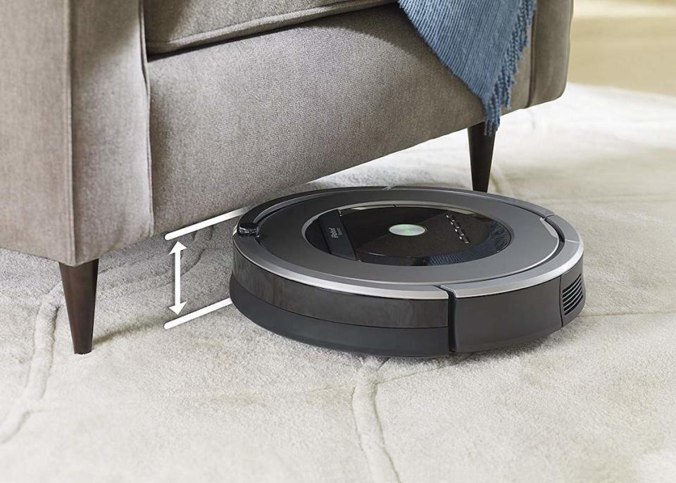 The Roomba is just 3.6 inches tall, so it fits under most furniture. (Photo: Amazon)