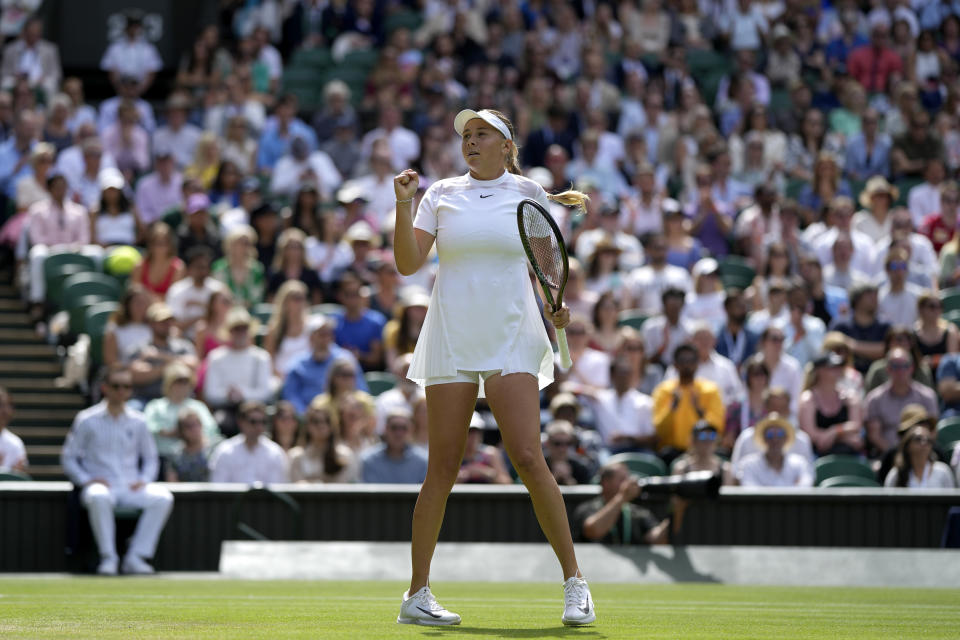 Amanda Anisimova of the US celebrates winning a point against Coco Gauff of the US in a third round women's singles match on day six of the Wimbledon tennis championships in London, Saturday, July 2, 2022. (AP Photo/Alastair Grant)
