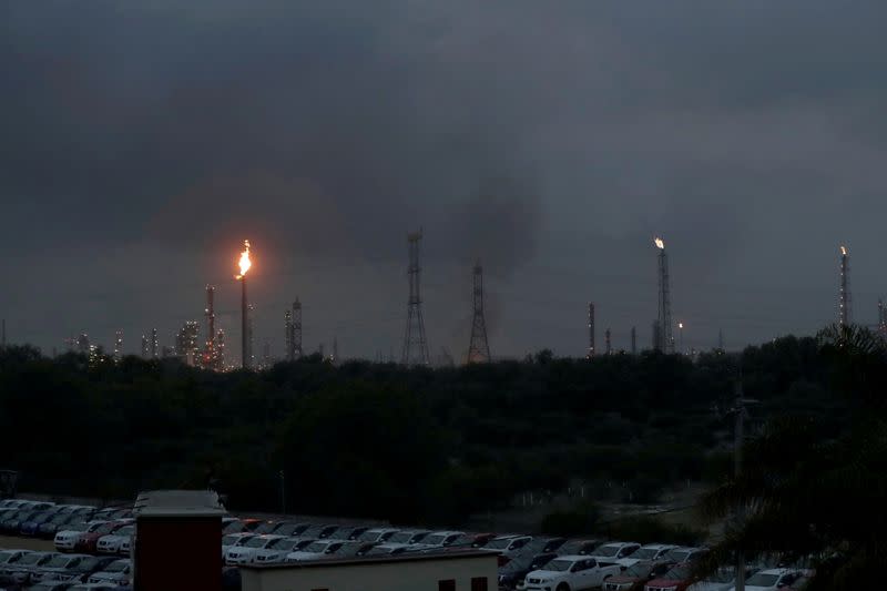 FILE PHOTO: Excess natural gas is burnt, or flared, from Mexican state-owned Pemex's Tula oil refinery, located adjacent to the Tula power plant belonging to national power company Comision Federal de Electricidad, or CFE, in Tula de Allende