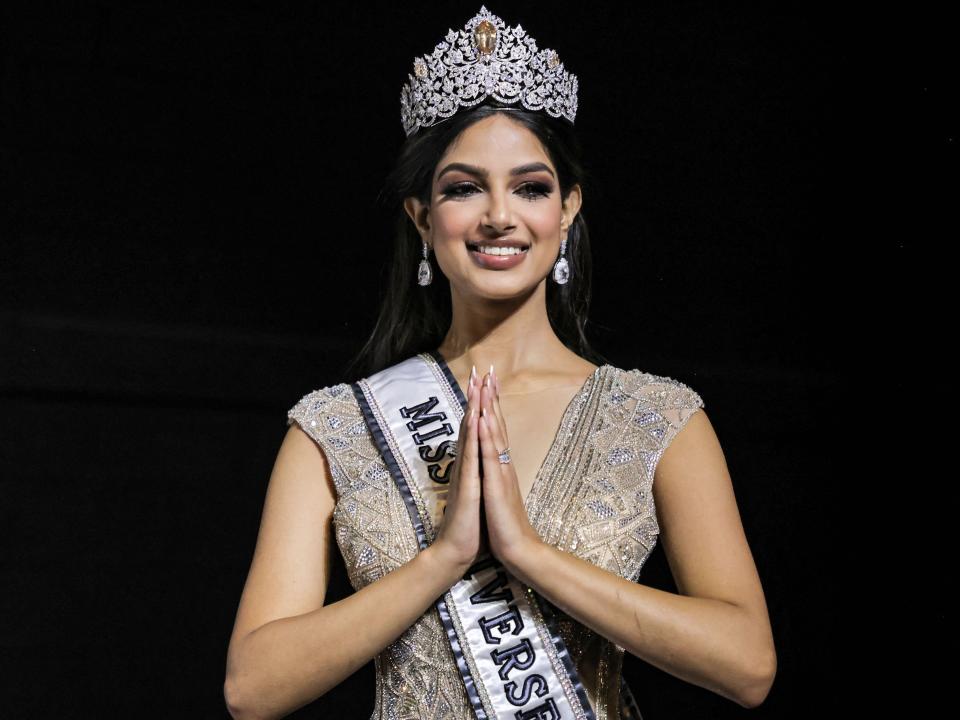 Miss Universe 2021 Harnaaz Sandhu (Miss India) poses for photos after winning the 70th Miss Universe beauty pageant in Israel's southern Red Sea coastal city of Eilat on December 13, 2021