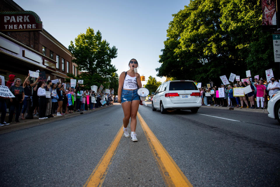 Mariah Stewart leads the crowd as they chant during a protest against the Supreme Court's recent decision to overturn Roe v. Wade Monday, June 27, 2022, in downtown Holland. 