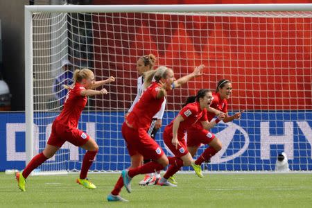 England midfielder Fara Williams (far right) reacts with teammates after scoring on a penalty kick against Germany in extra time during the third place match of the FIFA 2015 Women's World Cup at Commonwealth Stadium. England defeated Germany 1-0 in extra time. Erich Schlegel-USA TODAY Sports