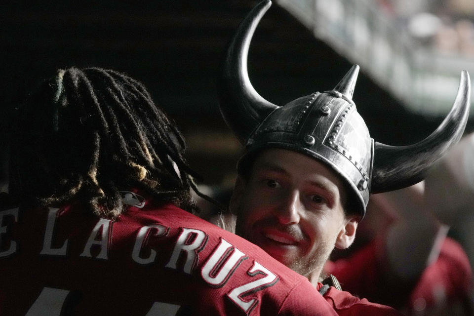 Cincinnati Reds' Spencer Steer, right, celebrates with Elly De La Cruz after hitting a solo home run against the Chicago Cubs during the eighth inning of a baseball game in Chicago, Thursday, Aug. 3, 2023. (AP Photo/Nam Y. Huh)