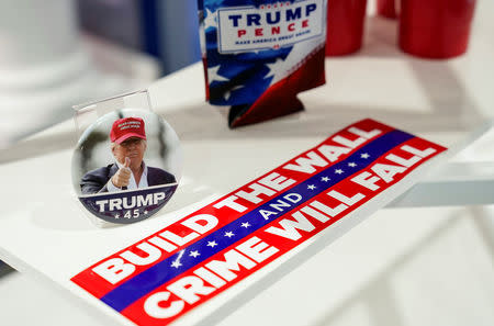 FILE PHOTO: A bumper sticker and pin are for sale at the Trump Victory booth at the Conservative Political Action Conference (CPAC) annual meeting at National Harbor in Oxon Hill, Maryland, U.S., March 2, 2019. REUTERS/Joshua Roberts/File Photo