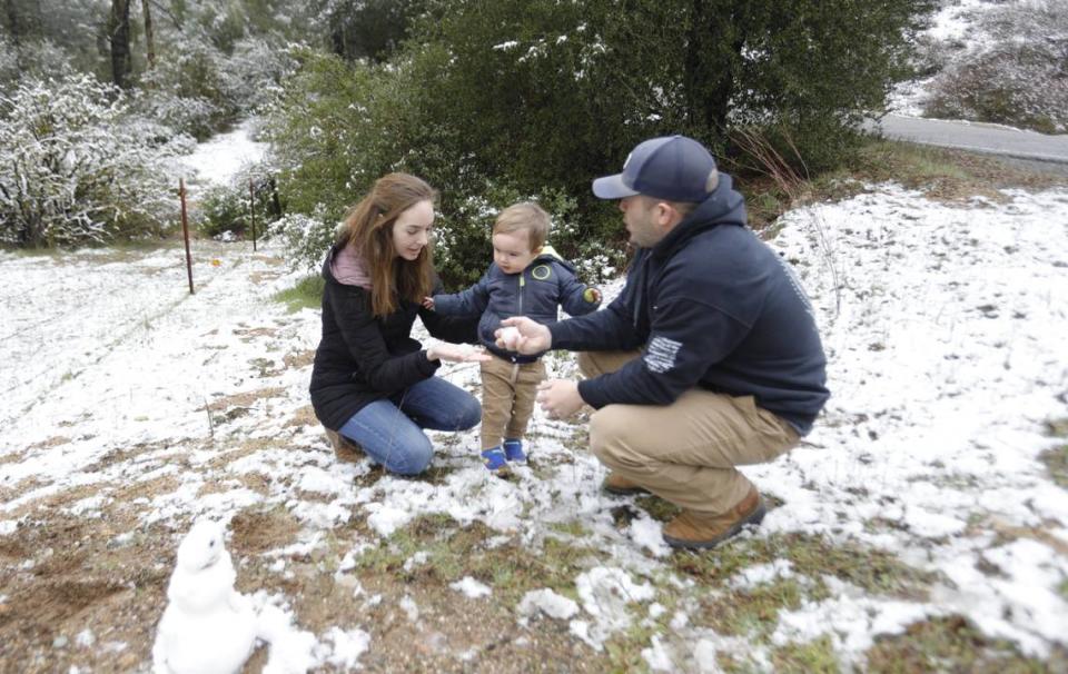 Tim and Katie Toole of San Miguel took toddler Liam, 1-1/2, out to see the fresh snow on Webster Road outside of Creston on Saturday, Feb. 25, 2023.