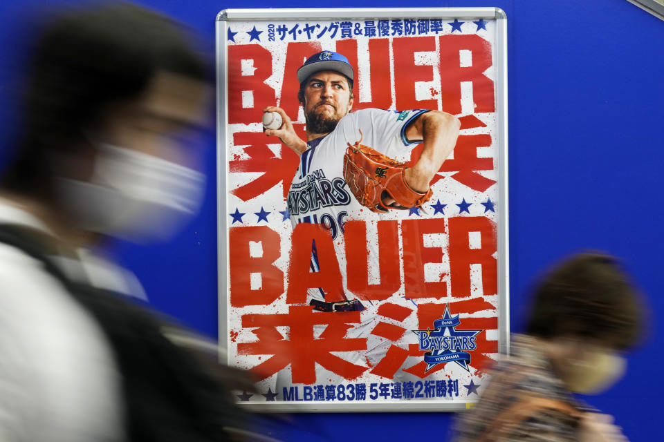 A poster of Trevor Bauer who's pitching for the Yokohama BayStars is placed at a train station on Tuesday, May 2, 2023, in Yokohama near Tokyo. Bauer will pitch his first official game for the Yokohama DeNA BayStars on Wednesday and, to promote the start, a local department store is to unveil a seven-story poster of the former Cy Young winner on the building's facade.(AP Photo/Eugene Hoshiko)