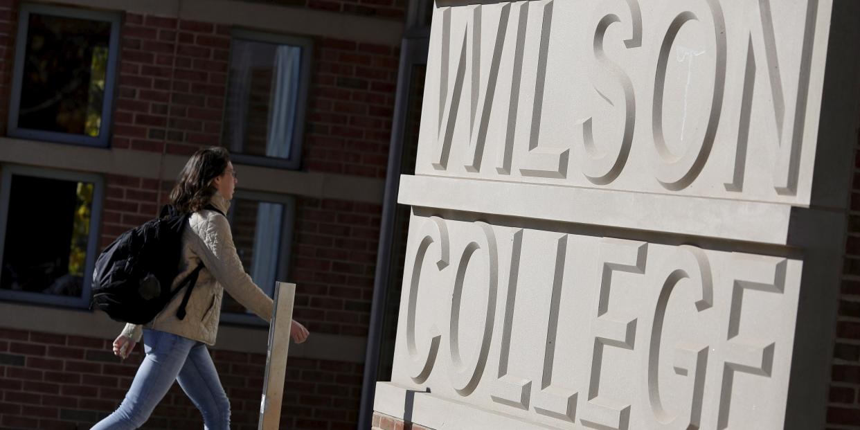 FILE PHOTO: A student walks toward Princeton University's Wilson College in Princeton, New Jersey, November 20, 2015.  REUTERS/Dominick Reuter