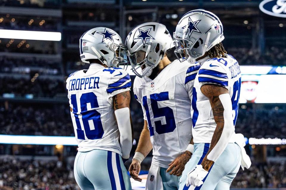 Dallas Cowboys wide receivers Jalen Cropper (16) and Tyron Billy-Johnson (80) celebrate with their quarterback Will Grier (15) after he ran in for a touchdown in the second half of a preseason game against the Las Vegas Raiders at AT&T Stadium in Arlington, Texas on Saturday, Aug. 26, 2023.