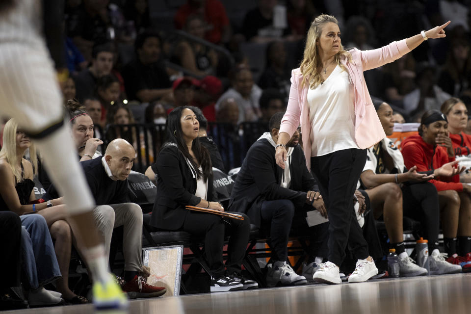 Las Vegas Aces head coach Becky Hammon, front right, directs her team against the Chicago Sky from the sideline during the second half of a WNBA basketball playoff series game, Sunday, Sept. 17, 2023, in Las Vegas. (Ellen Schmidt/Las Vegas Review-Journal via AP)