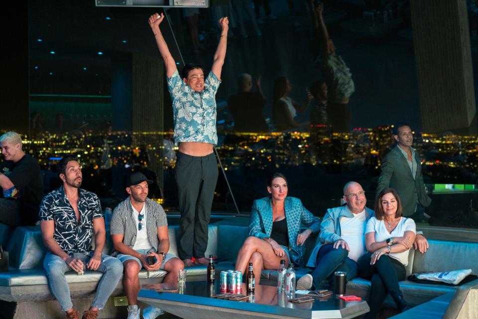 Visitors watch the Super Bowl in a subterranean nightclub.