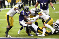 Baltimore Ravens quarterback Lamar Jackson (8) is stopped short of the goal line by a host of Pittsburgh Steelers defenders during the first half of an NFL football game, Sunday, Nov. 1, 2020, in Baltimore. (AP Photo/Nick Wass)