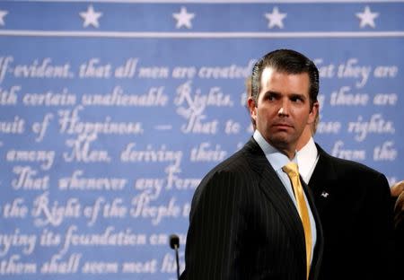 Donald Trump Jr. stands onstage with his father Republican U.S. presidential nominee Donald Trump after Trump's debate against Democratic nominee Hillary Clinton at Hofstra University in Hempstead, New York, U.S. on September 26, 2016. REUTERS/Brian Snyder/File Photo