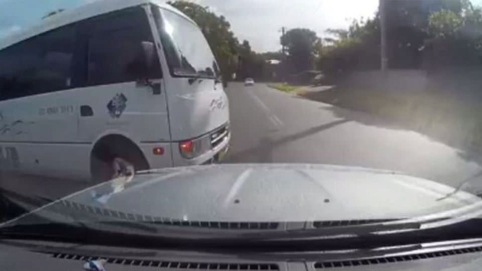 The bus driver appeared completely unaware that he was about to cut off the silver car. Source: Facebook