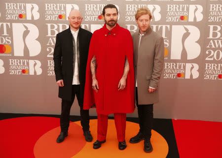 Ben Johnston, Simon Neil and James Johnston of Biffy Clyro arrive for the Brit Awards at the O2 Arena in London, Britain, February 22, 2017. REUTERS/Neil Hall
