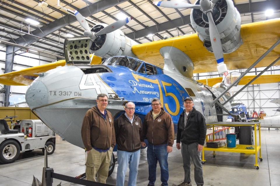 Several people were instrumental in bringing this PBY-6A Catalina amphibious airplane to Liberty Aviation Museum. Shown here are just a few: left to right, CEO Ed Patrick, Communications and Marketing Coordinator Jim Priebe, Director of Operations Bob Fujita and Chief Mechanic Scott Boyer.