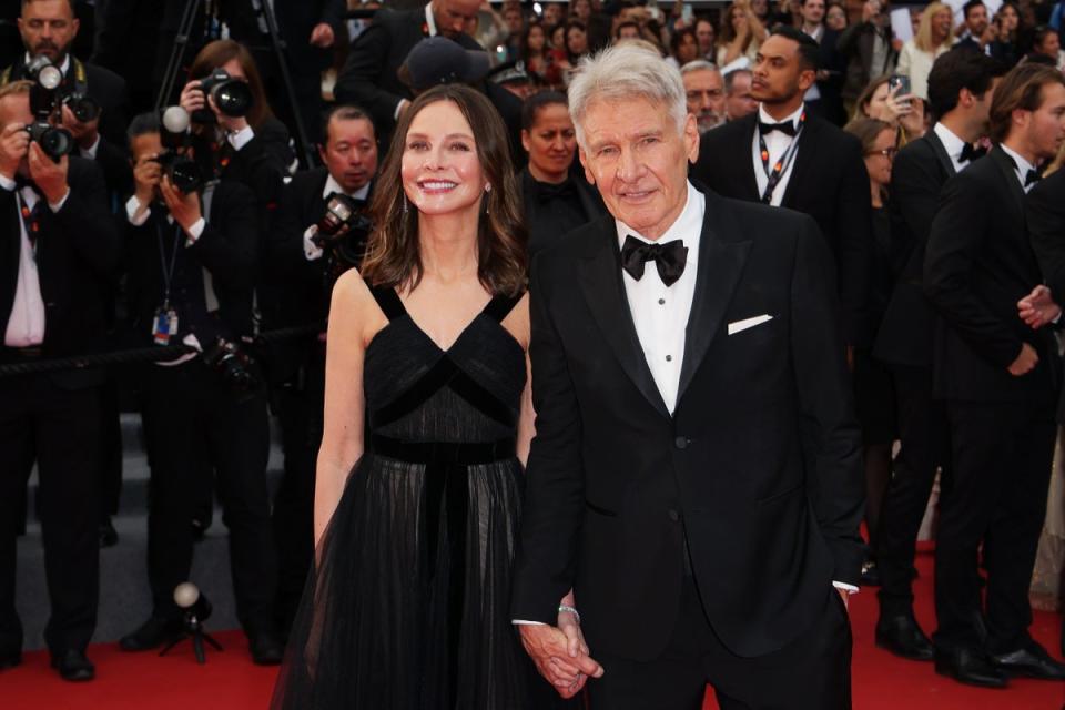 Harrison Ford and Calista Flockhart attend the Indiana Jones and The Dial of Destiny red carpet at 2023 Cannes Film Festival (Getty Images for Campari)