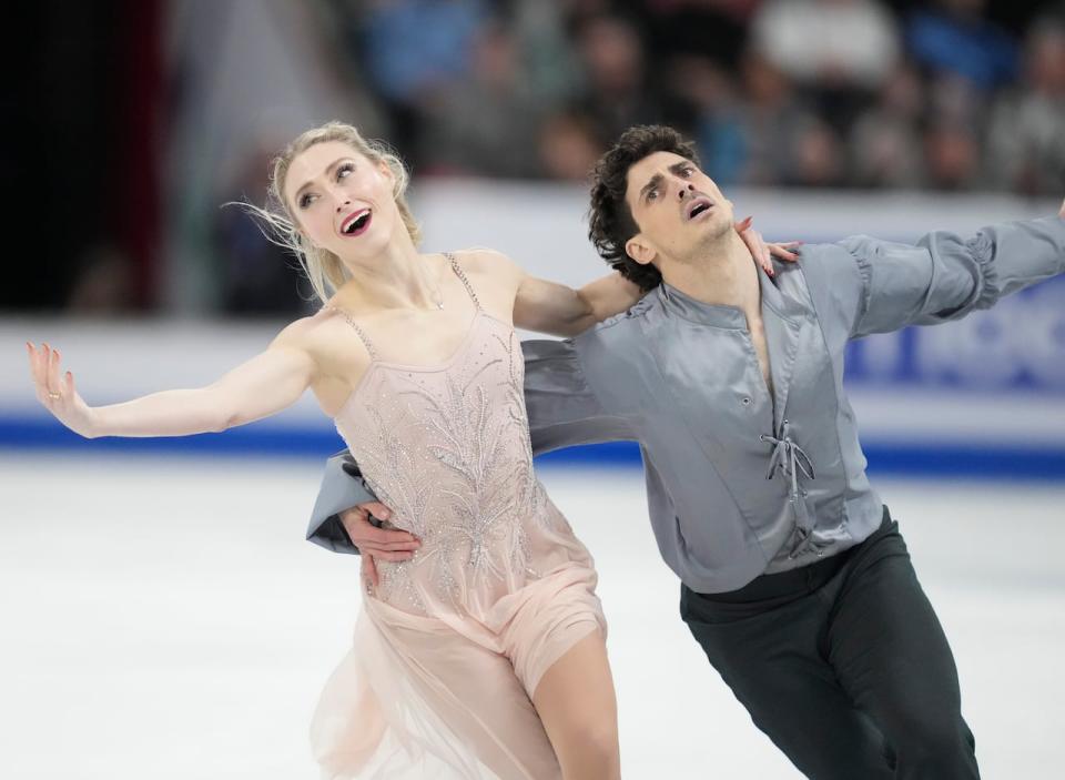 Piper Gilles, left, and Paul Poirier of Canada perform their free dance in the ice dance competition at the 2024 ISU World Figure Skating Championships in Montreal on Saturday, where they finished second. (Christinne Muschi/The Canadian Press - image credit)