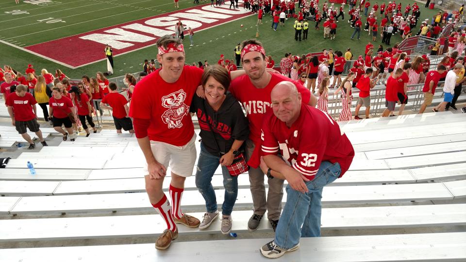 The Clements family, from left, JJ, Rhonda, Nick and John, pose at a Badgers game. John went into cardiac arrest during a Brewers-Nationals game in Washington and was revived by two bystanders who performed CPR.