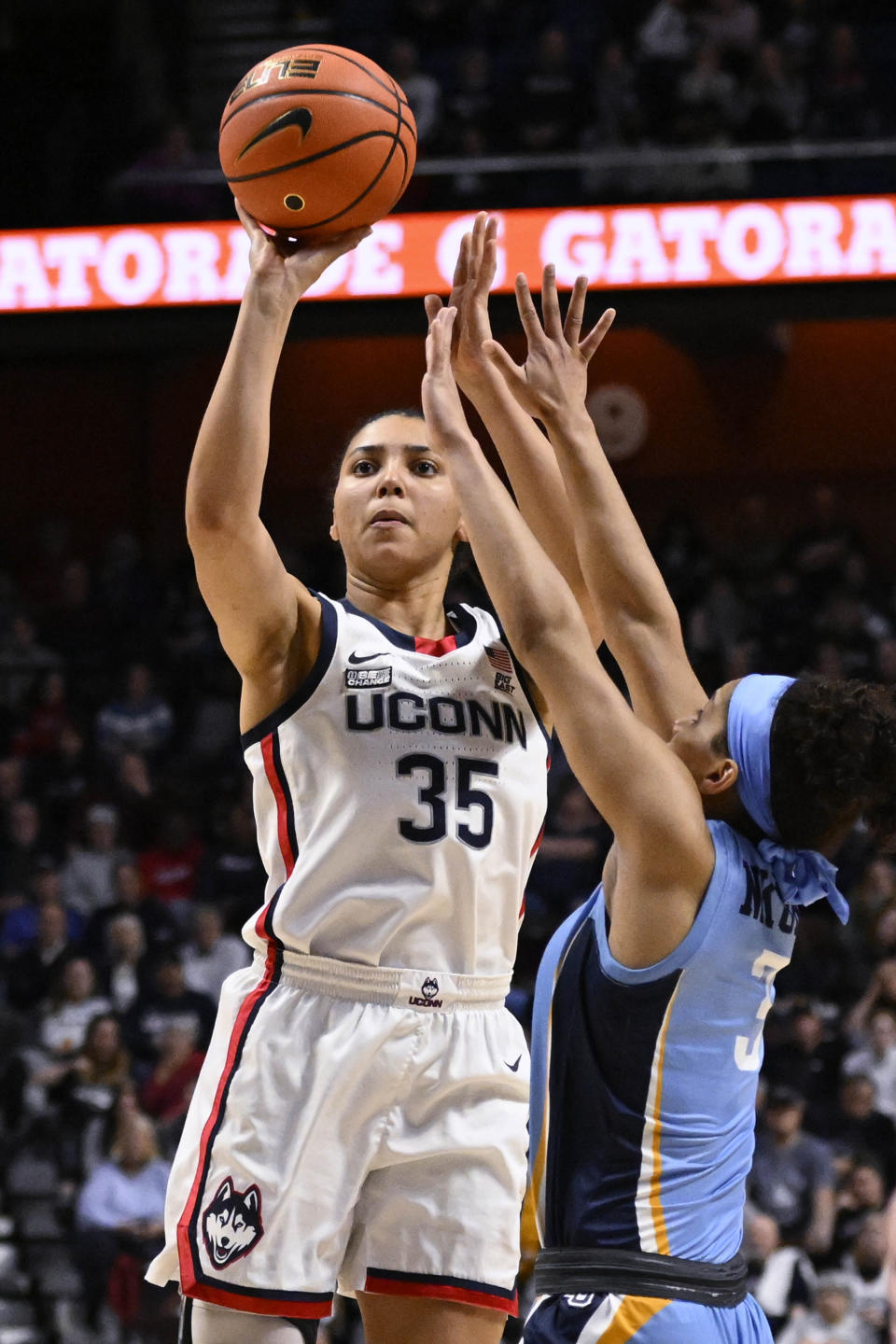 UConn's Azzi Fudd (35) shoots over Marquette's Rose Nkumu (3) during the second half of an NCAA college basketball game in the semifinals of the Big East Conference tournament at Mohegan Sun Arena, Sunday, March 5, 2023, in Uncasville, Conn. (AP Photo/Jessica Hill)