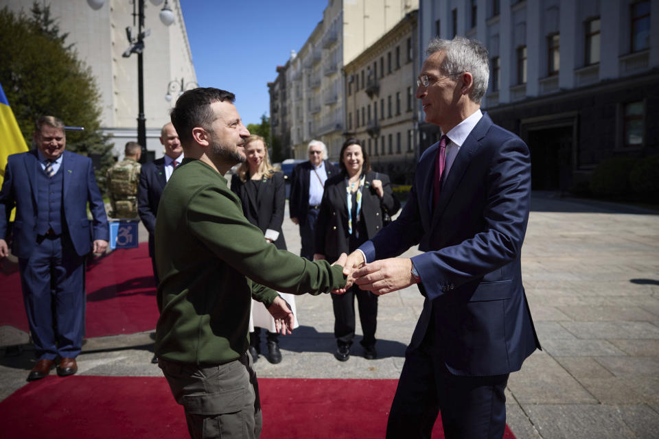 Ukrainian President Volodymyr Zelenskyy, left, welcomes NATO Secretary General Jens Stoltenberg during their meeting in Kyiv, Ukraine, Monday, April 29, 2024. (Ukrainian Presidential Press Office via AP)