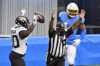 Jacksonville Jaguars running back James Robinson, left, celebrates after scoring against the Los Angeles Chargers during the first half of an NFL football game Sunday, Oct. 25, 2020, in Inglewood, Calif. (AP Photo/Kyusung Gong)