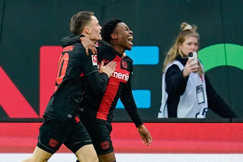 Leverkusen's goalscorer Nathan Tella (R) celebrates with Leverkusen's Florian Wirtz after scoring their side's second goal during the German Bundesliga soccer match between SV Darmstadt 98 and Bayer Leverkusen at the Merck-Stadion am Boellenfalltor. Uwe Anspach/dpa