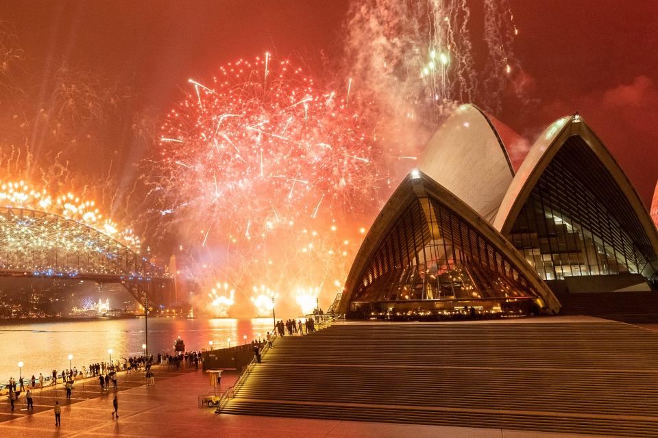 The Sydney Harbour fireworks display is seen over a near-empty Sydney Opera House forecourt during New Year's Eve celebrations on January 01, 2021 in Sydney, Australia.