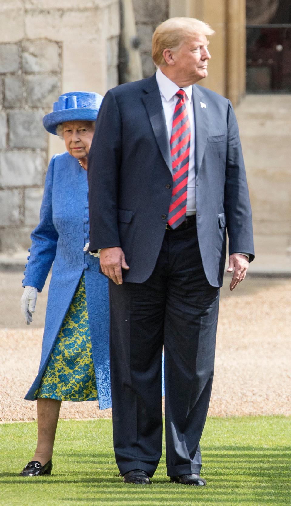 Donald Trump and Queen Elizabeth II inspect a Guard of Honour in 2018. Mr Trump claims he spoke to the Queen ‘all night long’ after he met her in 2019 (Richard Pohle  - WPA Pool/Getty Images)