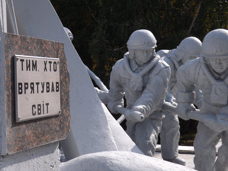 <span class="caption">The Monument to the Liquidators in Chernobyl, erected to commemorate the clean-up crew and, here, the firefighters who responded to the disaster. The inscription reads ‘To those who saved the world’.</span> <span class="attribution"><span class="source">Famagusta Gazette</span></span>