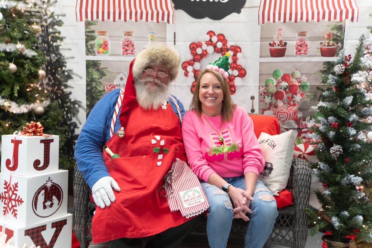 Mandy Williams, the owner of the Cake Company of Canyon sits with Santa Saturday at the Cake Company of Canyon.