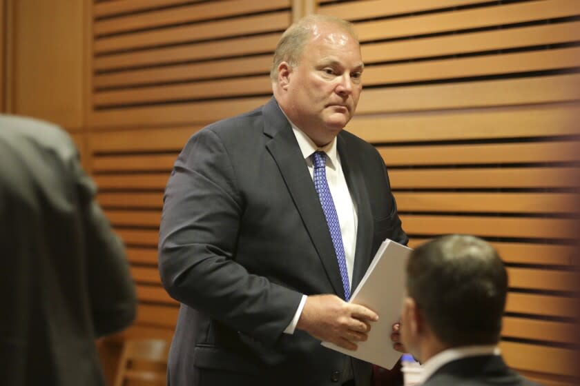 Former Wisconsin Supreme Court Justice Michael Gableman leaves the stand after testifying, Thursday, June 23, 2022, at the Dane County Courthouse in Madison, Wis. Gableman, hired to investigate President Joe Biden's victory in the battleground state, testified Thursday that he routinely deleted records, and deactivated a personal email account, even after receiving open records requests. (Kayla Wolf/Wisconsin State Journal via AP)