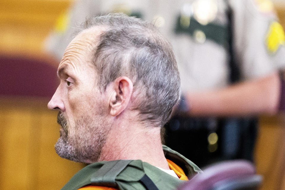 Kirby Gene Wallace sits before Judge Andy Brigham during his first appearance at the Stewart County Courthouse Tuesday, Oct. 9, 2018, in Dover, Tenn. Wallace, a multiple-murder suspect who led Tennessee law enforcement on an intense 7-day manhunt was captured without a struggle Friday morning, Oct. 5, in a wooded area about two hours northwest of Nashville. Wallace was wanted in two counties on charges that include murder, arson and kidnapping. (Courtney Pedroza/The Tennessean via AP, Pool)