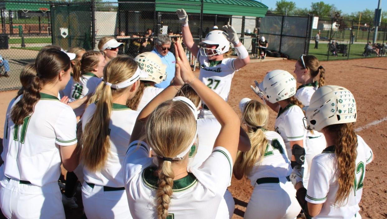 Freshman Olivia Piepsney is congratulated by her St. Mary Catholic Central teammates after one of her two home runs during a 5-3 win over Flat Rock on Tuesday, April 30, 2024.