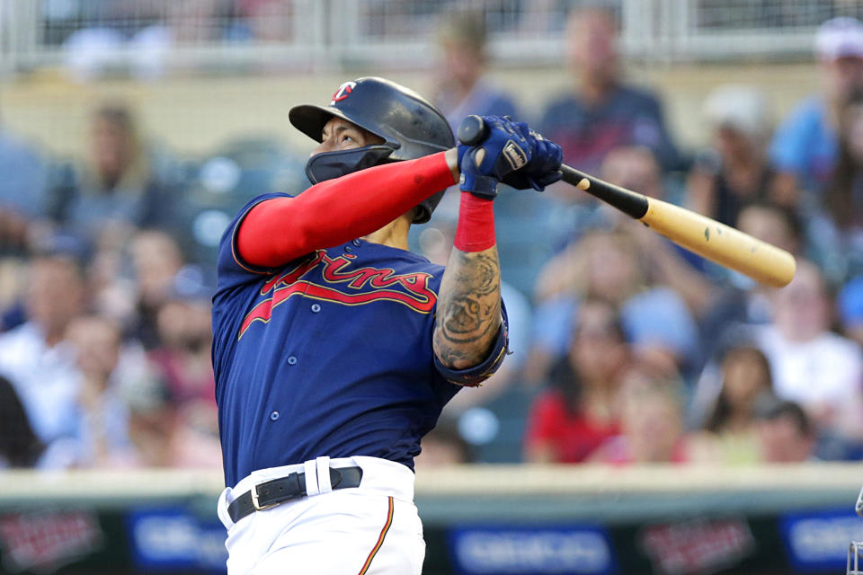 FILE - Minnesota Twins' Carlos Correa watches his home run against the Cleveland Guardians during the third inning of a baseball game Wednesday, June 22, 2022, in Minneapolis. Carlos Correa reversed course for a second time, agreeing Tuesday to a $200 million, six-year contract that keeps him with the Minnesota Twins after failing to complete agreements with the New York Mets and San Francisco Giants, a person familiar with the negotiations told The Associated Press on Tuesday, Jan. 10, 2022. (AP Photo/Andy Clayton-King, File)