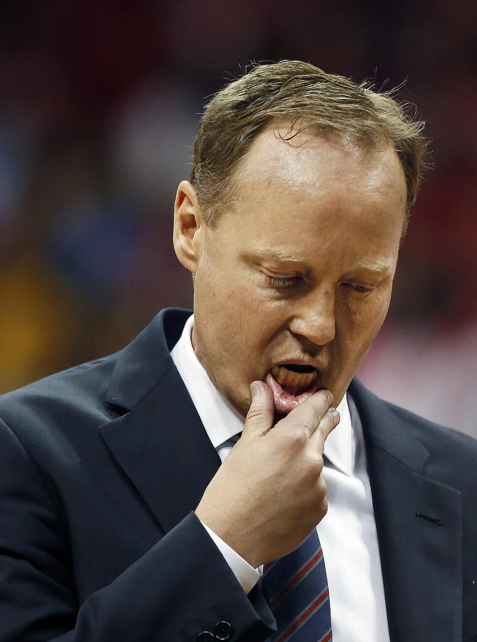 Atlanta Hawks head coach Mike Budenholzer prepares to speak to his players during a timeout in the second half of Game 6 of a first-round NBA basketball playoff series against the Indiana Pacers in Atlanta, Thursday, May 1, 2014. Indiana won 95-88. (AP Photo/John Bazemore)