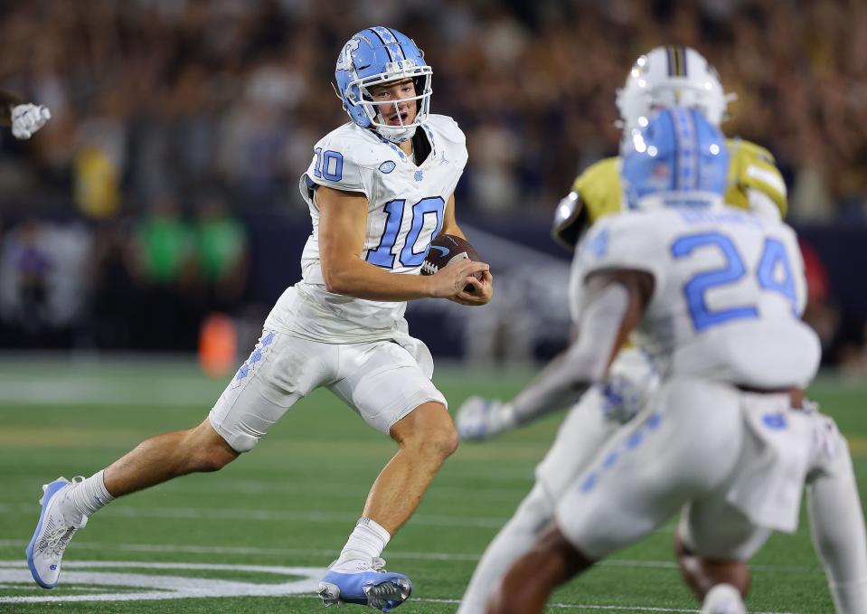 ATLANTA, GEORGIA - OCTOBER 28:  Drake Maye #10 of the North Carolina Tar Heels rushes against the Georgia Tech Yellow Jackets during the fourth quarter at Bobby Dodd Stadium on October 28, 2023 in Atlanta, Georgia. (Photo by Kevin C. Cox/Getty Images)