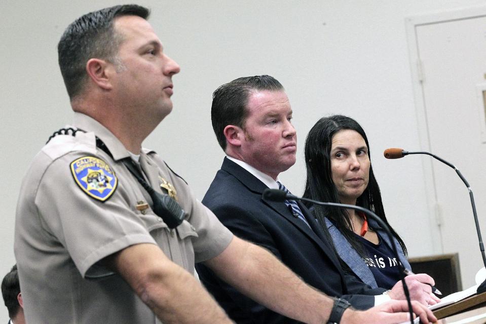 California Highway Patrol office Keith Odle, left, attorney William M. Concidine, center along with Cecilia Abadie, right, speak during a news conference, Thursday, Jan. 16, 2014 in San Diego. A San Diego traffic court threw out a citation Thursday against Abadie, a woman believed to be the first motorist in the country ticketed for driving while wearing a Google Glass computer-in-eyeglass device. (AP Photo/U-T San Diego, John Gastaldo, Pool)