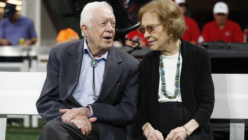 Former President Jimmy Carter and Rosalynn Carter are seen ahead of an NFL football game between the Atlanta Falcons and the Cincinnati Bengals, Sunday, Sept. 30, 2018, in Atlanta.