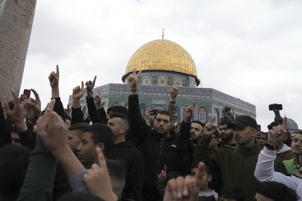 Palestinians protest a deadly Israeli raid in the West Bank city of Nablus, as well as a crackdown on Palestinian prisoners by Israel's right-wing government, following Friday prayers at the Dome of the Rock Mosque in the Al-Aqsa Mosque compound in the Old City of Jerusalem, Friday, Feb. 24, 2023. (AP Photo/Mahmoud Illean)